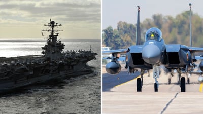 מטוסי קרב מסוג F-15 מימין, נושאת המטוסים אברהם לינקולן משמאל